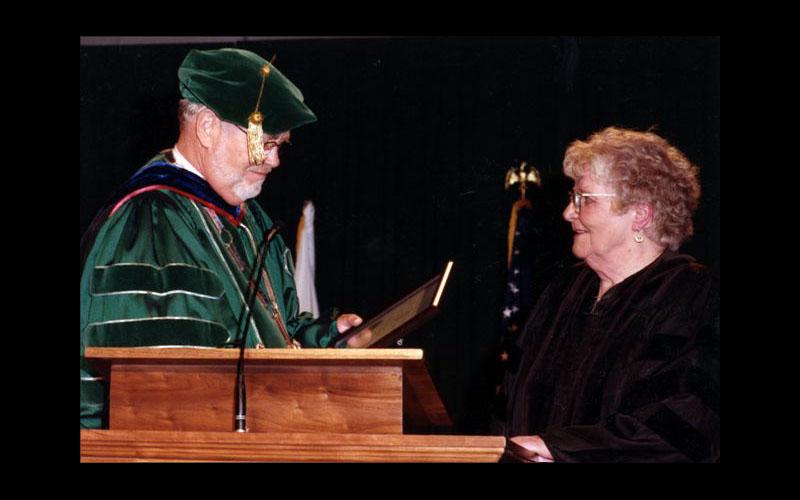 Jean Receives Honorary Doctorate | Dr. Dean Hubbard, president of Northwest Missouri State University, presents Jean Jennings Bartik with an Honorary Doctor of Science Degree. Jean graduated from Northwest in 1945 with a degree in Mathematics. (Courtesy of Jean JENNINGS Bartik Computing Museum)