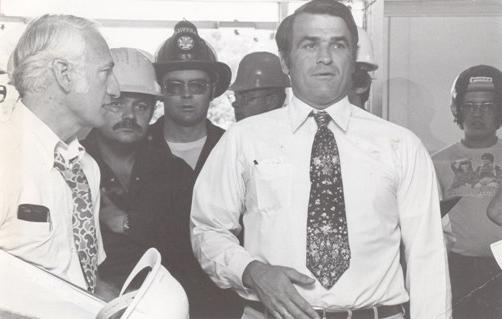 President Owens tours the Administration Building with Gov. Joe Teasdale two days after the fire that nearly destroyed the historic structure in 1979. Owens ably led Northwest through one of its worst disasters with determination. Under his leadership, the Administration Building was restored and the university library, constructed as a result of the disaster, was named in his honor when he retired in 1984.